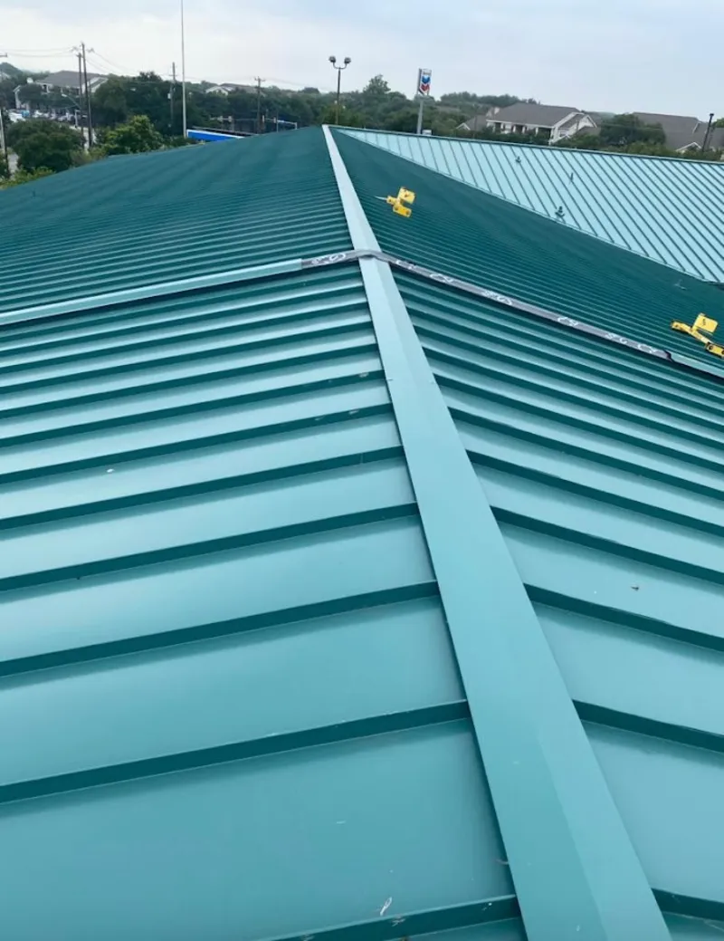 Green commercial metal roof ridge and valley for Metal Roof Repair in Belleville